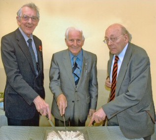 Three man and a cake