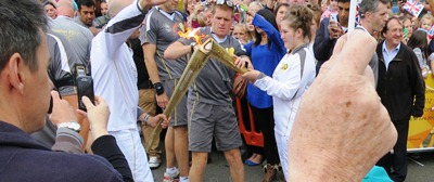 Olympic flames kiss